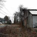 03/24/16: Dudley, MA: An old building (right) on the site where the Islamic Society of Worcester wants to build a cemetery, sits across the street from the home of Dudley resident Desiree Moninski (not pictured) on the left. (Globe Staff Photo/) section:metro topic:26cemeterys1