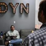 Manchester, NH, Tuesday, May 19, 2015: Meeting in the kitchen, Dynamic Network Services Inc CEO Jeremy Hitchcock, right, talks with security administrator Neil Schelly, left. DYN is a start up tech company situated in a renovated mill building. CREDIT: Cheryl Senter for The Boston Globe