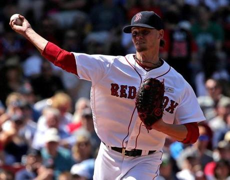 Boston, MA - 05/14/16 - (4th inning) Boston Red Sox starting pitcher Clay Buchholz (11) fires to first base to hold the runner during the fourth inning. The Boston Red Sox take on the Houston Astros in Game 3 of a four game series at Fenway Park. - (Barry Chin/Globe Staff), Section: Sports, Reporter: Peter Abraham, Topic: 15Sox Astros, LOID: 8.2.2933426785. 
