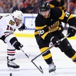BOSTON, MA - MARCH 03: Andrew Ladd #16 of the Chicago Blackhawks defends Kevan Miller #86 of the Boston Bruins during the second period at TD Garden on March 3, 2016 in Boston, Massachusetts. (Photo by Maddie Meyer/Getty Images)