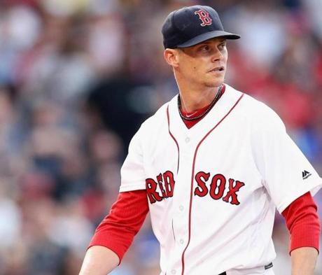BOSTON, MA - MAY 26: Clay Buchholz #11 of the Boston Red Sox walks to the dugout after pitching the first inning against the Colorado Rockies during the first inning at Fenway Park on May 26, 2016 in Boston, Massachusetts. (Photo by Maddie Meyer/Getty Images)
