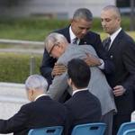 U.S. President Barack Obama hugs Shigeaki Mori, an atomic bomb survivor; creator of the memorial for American WWII POWs killed at Hiroshima, during a ceremony at Hiroshima Peace Memorial Park in Hiroshima, western Japan, Friday, May 27, 2016. Obama on Friday became the first sitting U.S. president to visit the site of the world's first atomic bomb attack, bringing global attention both to survivors and to his unfulfilled vision of a world without nuclear weapons. (AP Photo Carolyn Kaster)
