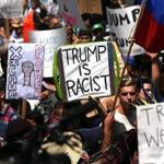 Demonstrators protested outside of an arena in San Diego Friday where Republican presidential candidate Donald Trump held a campaign rally. 