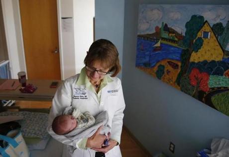 Dr. Sharon F. Daley, chief of pediatrics at Cape Cod Hospital, held a baby being treated for symptoms of withdrawal.
