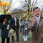 BOSTON, MA - 5/05/2016: City of Boston Mayor Marty Walsh interacting with members of the black community who were at at Almont Park in Mattaphan. Annie Kinkade is at back left with green coat and umbrella.(David L Ryan/Globe Staff Photo) SECTION: METRO TOPIC 09Walsh