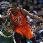 Oklahoma City Thunder's Kevin Durant (35) looks to move on Boston Celtics' Marcus Smart (36) during the first quarter of an NBA basketball game in Boston, Wednesday, March 16, 2016. The Thunder won 130-109. (AP Photo/Michael Dwyer)