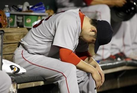 Boston Red Sox relief pitcher Junichi Tazawa sits in the dugout after being removed during the eighth inning of a baseball game against the Baltimore Orioles in Baltimore, Thursday, June 2, 2016. Baltimore won 12-7. (AP Photo/Patrick Semansky)
