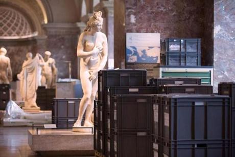 Boxes containing artworks were evacuated from the Louvre museum?s basement following days of heavy rains. 
