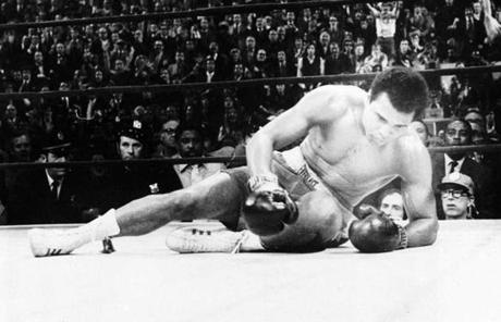 Ali lay on the canvas after he was knocked down by Joe Frazier during their 1971 fight at Madison Square Garden.
