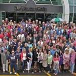 Former and current employees of The Boston Globe gathered Sunday for a photo at the company?s headquarters on Morrissey Boulevard.