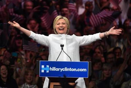 Democratic presidential candidate Hillary Clinton acknowledges celebratory cheers from the crowd during her primary night event at the Duggal Greenhouse, Brooklyn Navy Yard, June 7, 2016 in New York. Hillary Clinton hailed a historical 