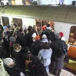 Boston, MA 021115 Commuters board an inbound train on the orange line at North Station in Boston, Wednesday, February 11 2015. (Wendy Maeda/Globe Staff) section: Metro slug: 12snowcommute reporter: 