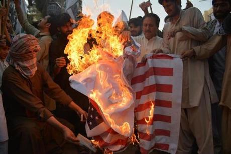 Pakistani demonstrators torch a US flag during a protest against a US drone strike in Pakistan's southwestern province Balochistan, in Quetta on June 10, 2016. Afghan Taliban leader Mullah Akhtar Mansour was killed in a US drone strike deep inside Pakistani territory on May 21 along with a driver. / AFP / BANARAS KHAN (Photo credit should read BANARAS KHAN/AFP/Getty Images)
