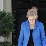 Elizabeth Warren departed the Washington home of Democratic presidential candidate Hillary Clinton.