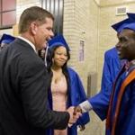 Boston Mayor Marty Walsh greeted soon-to-be graduates before a ceremony at the Jeremiah Burke High School in Boston last Friday. 