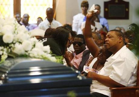 Raekwon Jaquay Brown's mother and father were seen during his funeral in Dorchester. 
