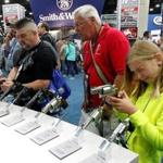 Gun enthusiasts looked over Smith & Wesson weapons at the National Rifle Association?s annual meetings and exhibits show in Louisville, Ky., in May. 