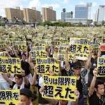 Protesters in Naha expressed anger Sunday over the presence of US forces in Okinawa. A former Marine has been arrested in connection with the killing of a local woman.
