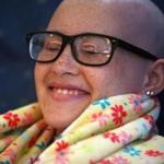 Carlie Gonzalez, 15, who has Ewing?s sarcoma, reacted to the reflexology being performed on her feet.