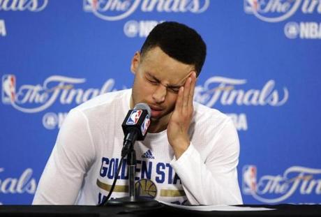 Golden State Warriors' Stephen Curry answers questions during a post-game news conference after Game 7 of basketball's NBA Finals on Sunday, June 19, 2016, in Oakland, Calif. Cleveland won 93-89. (AP Photo/Eric Risberg)
