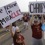 Cleveland Cavaliers fans hold up signs before the arrival of the team in Cleveland after winning the NBA Championship. 