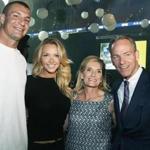 From left: Rob Gronkowski and Camille Kostek with Cyndy and John Fish.