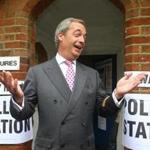 United Kingdom Independence Party leader, Nigel Farage, gestured as he arrives to cast his vote in Biggin Hill, south eastern England.