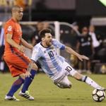 Argentina's Lionel Messi (right) tripped ahead of Chile's Francisco Silva during extra time.