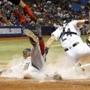 Jun 28, 2016; St. Petersburg, FL, USA; Boston Red Sox first baseman Hanley Ramirez (13) slides safe into home plate to score as Tampa Bay Rays catcher Hank Conger (24) attempts to tag him out during the fifth inning at Tropicana Field. Mandatory Credit: Kim Klement-USA TODAY Sports