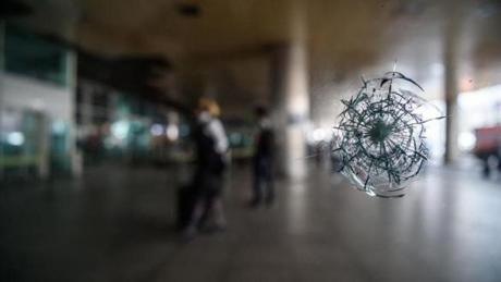 TURKEY SLIDER3 A bullet impact is pictured on a window on June 29, 2016 at Ataturk International airport in Istanbul, a day after a suicide bombing and gun attack targeted Istanbul's airport, killing at least 36 people. A triple suicide bombing and gun attack that occurred on June 28, 2016 at Istanbul's Ataturk airport has killed at least 36 people, including foreigners, with Turkey's prime minister saying early signs pointed to an assault by the Islamic State group. / AFP PHOTO / OZAN KOSEOZAN KOSE/AFP/Getty Images
