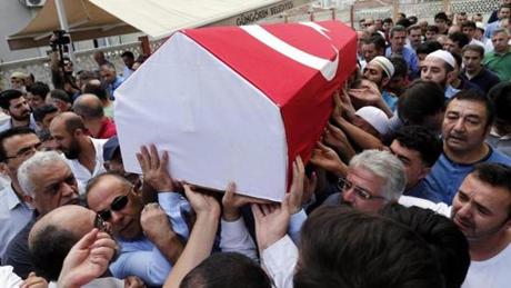 TURKEY SLIDER3 epa05397490 Relatives of Siddik Turgan, a custom officer at Ataturk Airport who was killed in the attacks on 28 June, carry his coffin during a funeral in Istanbul, Turkey, 29 June 2016. At least 36 people were killed and more than 140 others were wounded in three separate gun and bomb attack outside and inside the terminal of Istanbul's Ataturk international airport on 28 June, media reported quoting officials. The attacks have been linked to either the Islamic State (IS or ISIS) militant group or Kurdish separatists, media added EPA/DENIZ TOPRAK
