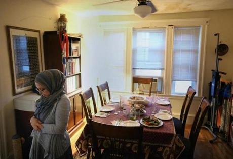 CAMBRIDGE, MA - 6/23/2016: Aicha Belabbes says her afternoon prayer before breaking the daily Ramadan fast with her family at her home in Cambridge on Thursday, June 23, 2016. Fasting during Ramadan is more difficult this year because the month falls around the summer solstice, when daylight lasts longest during the year. (Timothy Tai for The Boston Globe)
