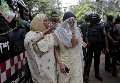 A relative tries to console Bangladeshi woman Semin Rahman, center, whose son is missing after militants took hostages in a restaurant popular with foreigners in Dhaka, Bangladesh, Saturday, July 2, 2016. Bangladeshi forces stormed the Holey Artisan Bakery in Dhaka's Gulshan area where heavily armed militants held dozens of people hostage Saturday morning, rescuing some captives including foreigners at the end of the 10-hour standoff. (AP Photo)
