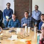 04/11/2016 BOSTON Co-founders Patrick Petitti (cq) (sitting left) and Rob Biederman (cq) (sitting right) spoke with employees during an office meeting at HourlyNerd (cq) in Boston. (Aram Boghosian for The Boston Globe) 