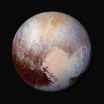 This image made available by NASA on Friday, July 24, 2015 shows a combination of images captured by the New Horizons spacecraft with enhanced colors to show differences in the composition and texture of Pluto's surface. The images were taken when the spacecraft was 280,000 miles (450,000 kilometers) away. (NASA/JHUAPL/SwRI via AP)