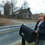 Dudley resident Desiree Moninski was pictured in a March 24 photo in front of her house, across the street from the site where the Islamic Society of Greater Worcester wants to build a cemetery in the town of Dudley. 