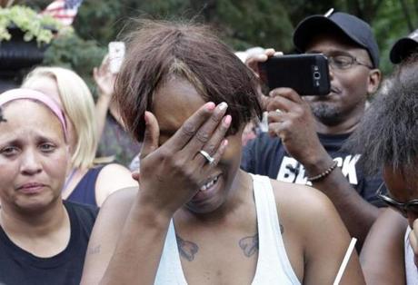 Diamond Reynolds, the girlfriend of Philando Castile, cries outside the governor's residence in St. Paul, Minn., on Thursday. Castile was shot and killed after a traffic stop by police Wednesday night. A video shot by Reynolds of the shooting went viral.

