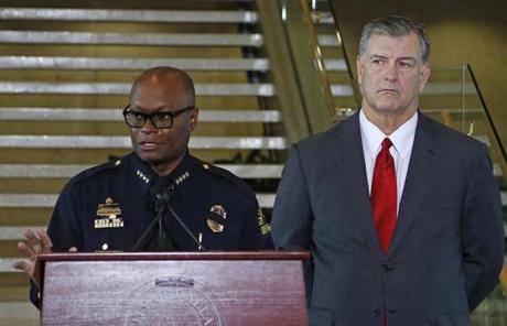 DALLAS, TX - July 8, 2016: Dallas Mayor Mike Rawlings (R) looks on during a press conference at Dallas City Hall as Dallas Police Chief David Brown speaks on the fatal shootings of five police officers on July 8, 2016 in Dallas, Texas. At least one sniper killed five officers and wounded seven others in a coordinated ambush at a anti-police brutality demonstration in Dallas. The sniper was killed, and three other people are in custody, officials said. (Photo by Stewart F. House/Getty Images)
