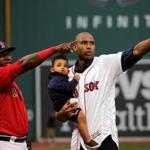 Boston, MA - 7/08/2016 - Four-time All-Star and newest Boston Celtics NBA free agent signee Al Horford, holding son Ean, 16 months, with Boston Red Sox designated hitter David Ortiz (34) after throwing out the ceremonial first pitch before the Boston Red Sox take on the Tampa Bay Rays at Fenway Park. Ortiz caught the ceremonial pitch. The Boston Red Sox take on the Tampa Bay Rays in Game 1of a 3 game series at Fenway Park. - (Barry Chin/Globe Staff), Section: Sports, Reporter: Peter Abraham, Topic: 09Red Sox-Rays, LOID: 8.2.3564536203.