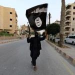 A member loyal to the Islamic State in Iraq and the Levant (ISIL) waved an ISIL flag in Raqqa in June.