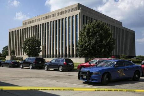 Police tape surrounds the Berrien County Courthouse on Monday, July 11, 2016 in St. Joseph, Mich. Two bailiffs were fatally shot Monday inside the courthouse before officers killed the gunman, a sheriff said. (Chelsea Purgahn/Kalamazoo Gazette via AP)
