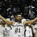 FILE - In this June 15, 2014, file photo, San Antonio Spurs forward Tim Duncan (21) celebrates after Game 5 of the NBA basketball finals in San Antonio. Duncan announced his retirement on Monday, July 11, 2016, after 19 seasons, five championships, two MVP awards and 15 All-Star appearances. It marks the end of an era for the Spurs and the NBA. (AP Photo/David J. Phillip, File)