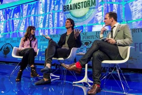 Adam Neumann (C), CEO of WeWork, and his wife Rebekah Newmann (L), chief brand officer for the company, are shown onstage as they are interviewed by Fortune's Andrew Nusca during the Fortune Brainstorm Tech conference in Aspen, Colorado, U.S. July 11, 2016. Stuart Isett/Fortune Brainstorm TECH/Handout via Reuters ATTENTION EDITORS - THIS IMAGE WAS PROVIDED BY A THIRD PARTY. EDITORIAL USE ONLY. NO RESALES. NO ARCHIVES.
