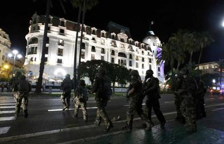 French soldiers advanced on a street in Nice.
