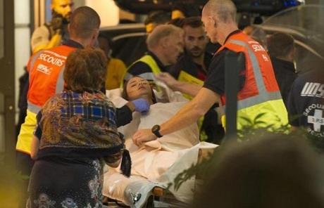 FRANCE SLIDER2 epa05425167 Emergency team assist wounded people as they evacuate from the scene where a truck crashed into the crowd during the Bastille Day celebrations in Nice, France, 14 July 2016. According to reports, at least 70 people died and many were wounded after a truck drove into the crowd on the famous Promenade des Anglais during celebrations of Bastille Day. Anti-terrorism police took over the investigation in the incident, media added. EPA/OLIVIER ANRIGO
