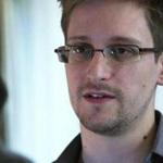 Former National Security Agency contractor-turned-whistleblower Edward Snowden is working with an MIT Media Lab researcher to build a device to protect journalists? smartphones from government spies. 
