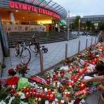A memorial grew on Saturday outside the Olympia shopping mall, where the shooting rampage on Friday began. Most of the dead were youths and all were Munich residents.