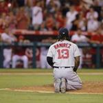 epa05446837 Boston Red Sox first baseman Hanley Ramirez of the Dominican Republic kneels on the mound in the bottom of the ninth inning during the MLB baseball game between the Boston Red Sox and the Anaheim Angels at Angel Stadium in Anaheim, California, USA, 28 July 2016. The Angels scored two runs in the bottom of the ninth inning to beat the Red Sox 2-1. EPA/PAUL BUCK