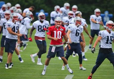 Foxborough-07/29/2016-The New England Patriots held their 2nd day of training camp at the practice fields of Gillette Stadium. Qb Jimmy Garoppolo leads the team in warmups. Boston Globe staff photo by John Tlumacki(sports)

