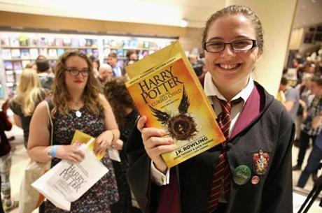 A woman held copies of ?Harry Potter and the Cursed Child? in a bookstore in London early Sunday. The play made its debut on stage Saturday and was released around the world in book form on Sunday.
